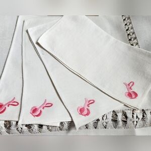 FOUR HANDMADE VINTAGE EMBROIDERED NAPKINS